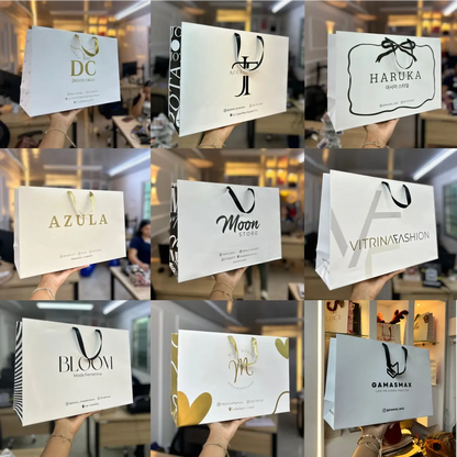 Bolsa premium rosada con cinta negra y logo de boutique
